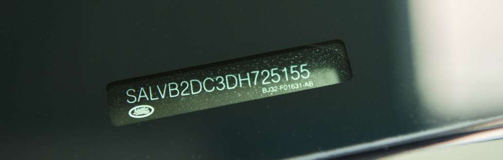 Close up of a VIN code on the windscreen of a car.jpg